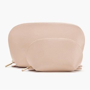 Brand new, never used, blush colored, Cuyana travel pouch set.